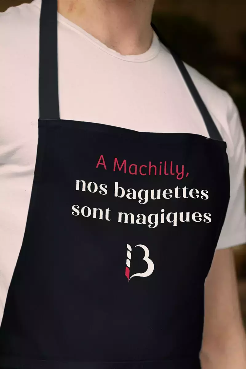 Tablier personnalisé "Nos baguettes sont magiques" pour la boulangerie Bourguignon.